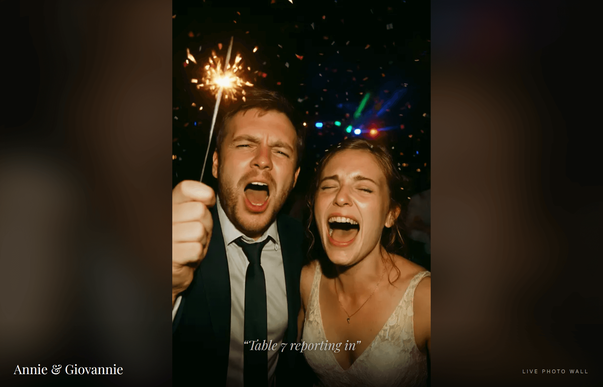 The venue screen showing a live guest photo (a couple with a sparkler) labelled LIVE PHOTO WALL
